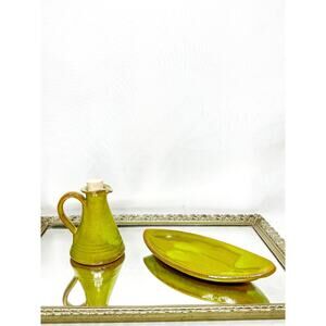 Small green terracotta pitcher with a cork to serve raki in the mountains